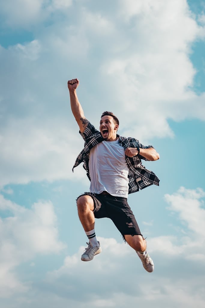 Low Angle Photography of Man Jumping