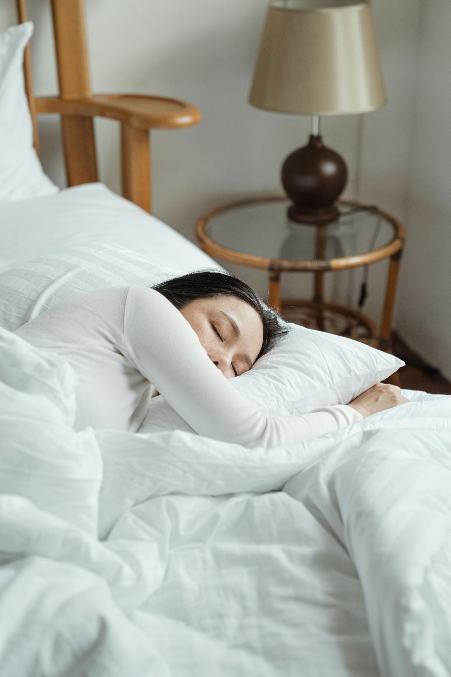 Young woman sleeping in comfy bed