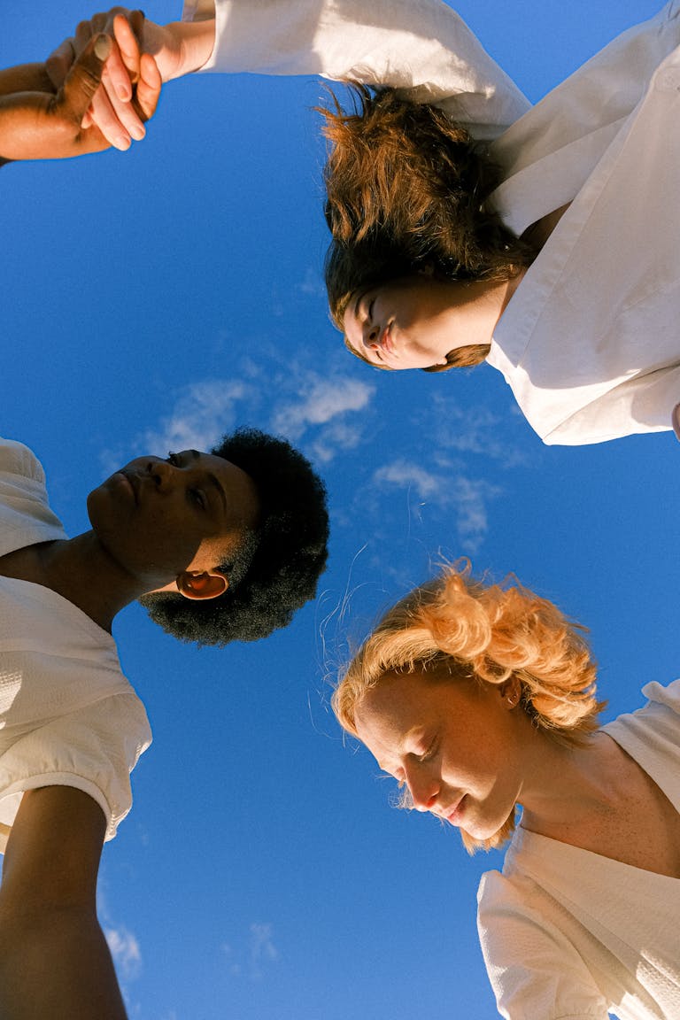 Photo Of Women Holding Each Other's Hands